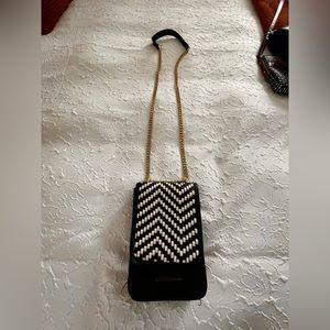 7x5 man made material over the body strap cell phone and card holder/purse.